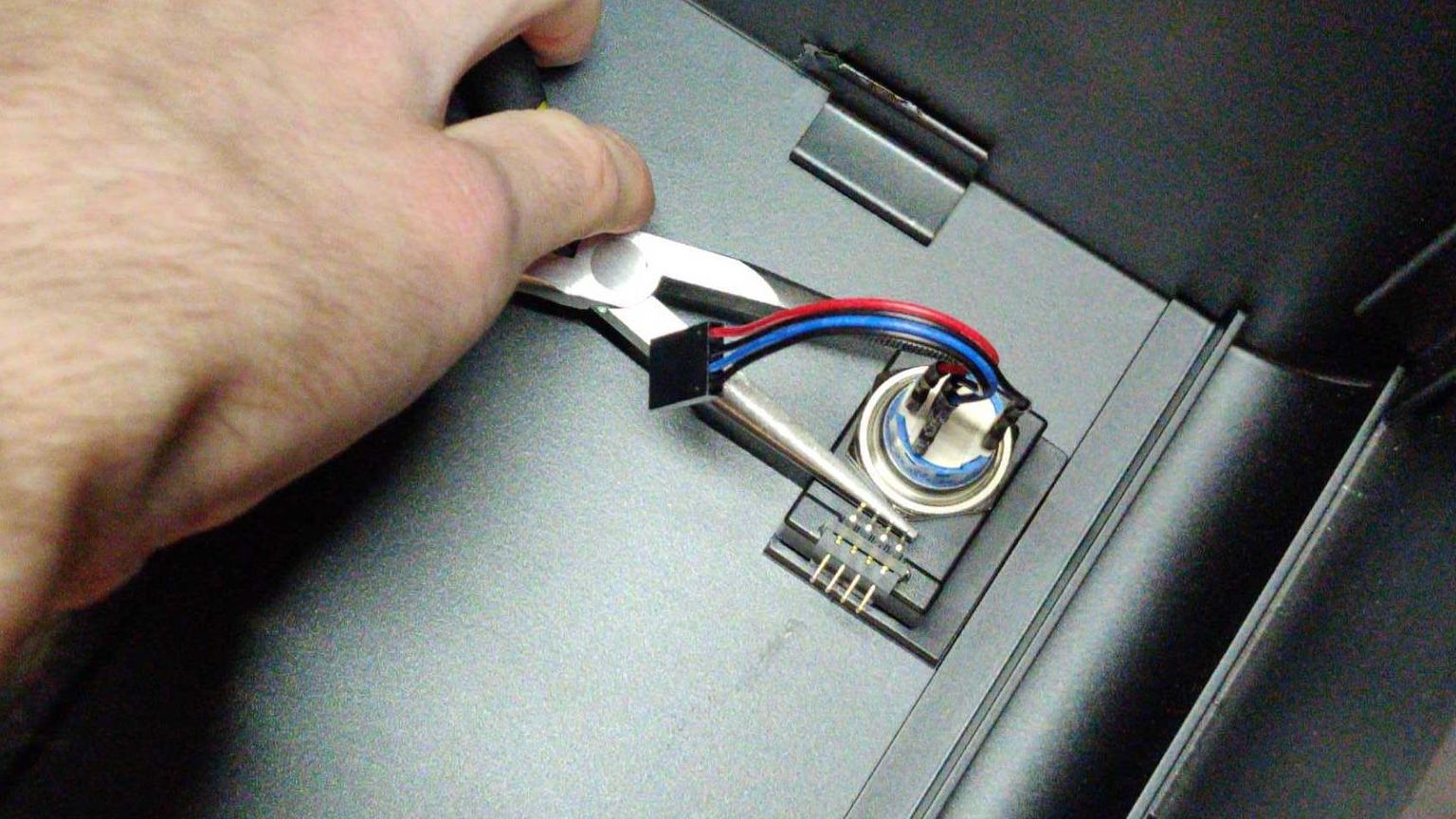 Screwing in the power button
